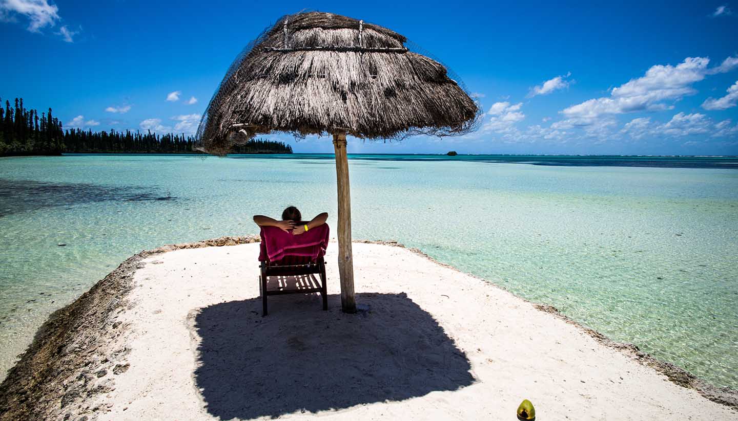 Neukaledonien - Person relaxing on a tropical beach