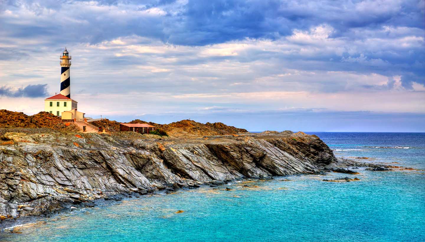 Menorca - Cap de Favaritx sunset lighthouse cape in Mahon