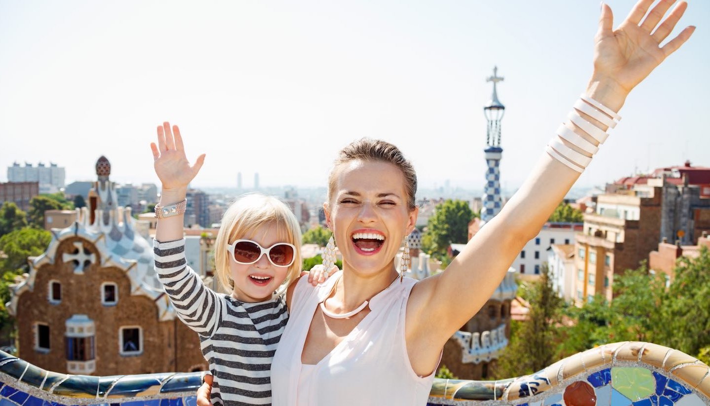 Barcelona - Happy mother and baby at Park Guell rejoicing, Barcelona